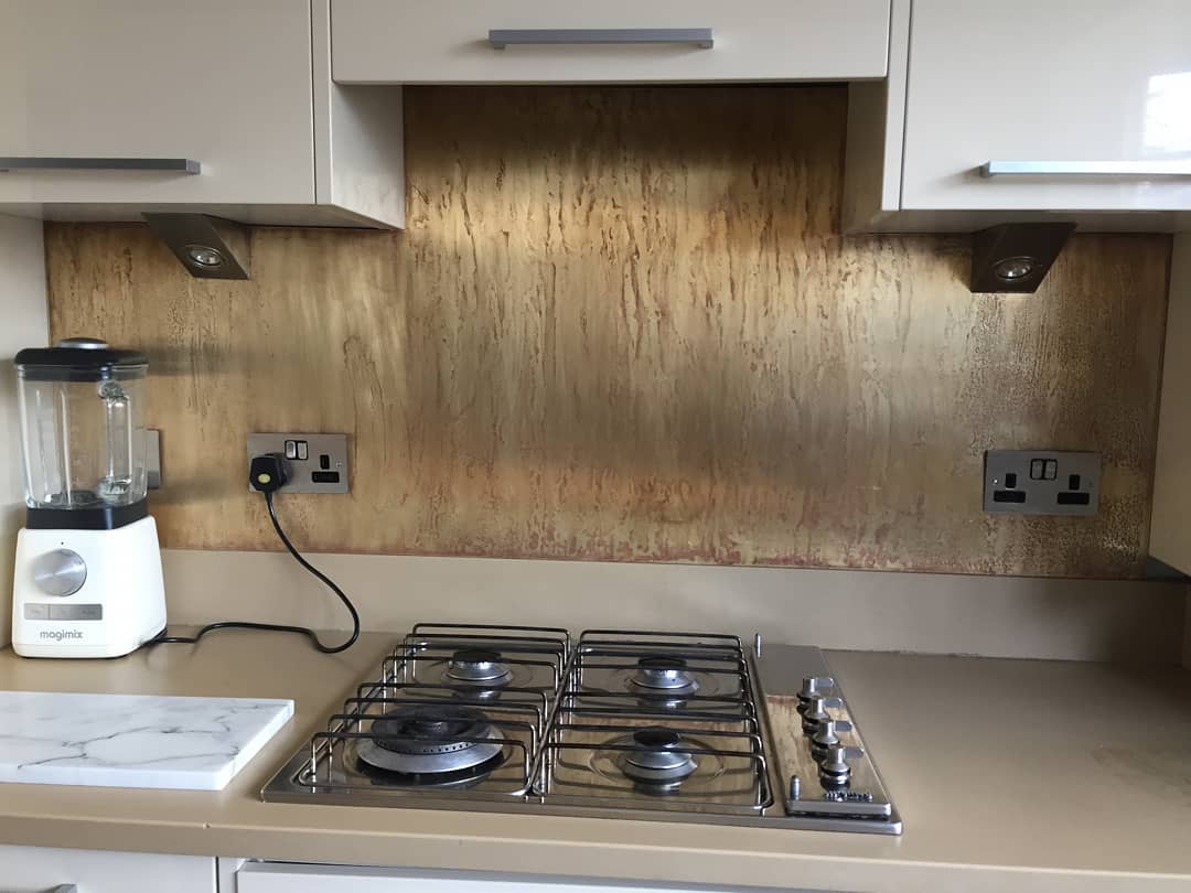 Brass patina splashback